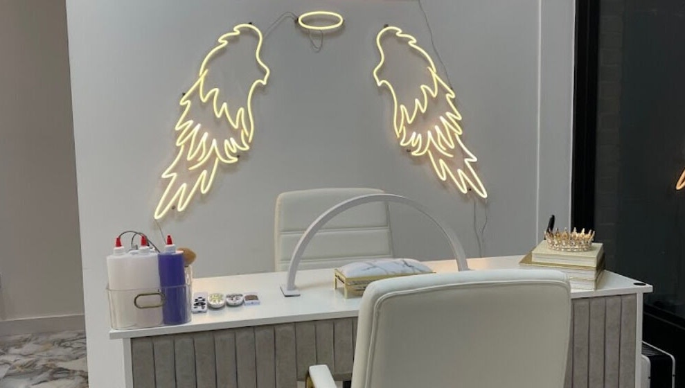 House of Nailz salon interior in Dunstable with gold logo and manicure station